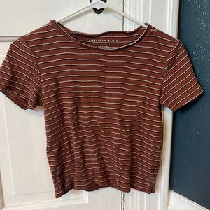 Small oranger American Eagle t-shirt with black and white stripe’s